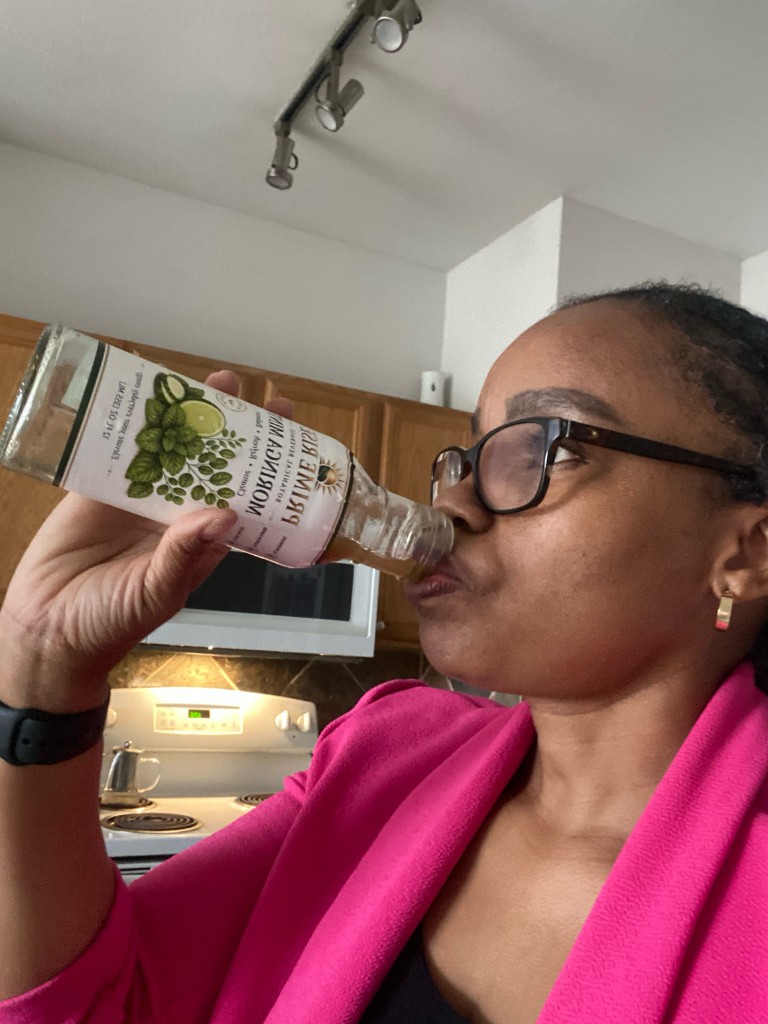 Customer drinking Prime Rise Moringa Mint at home