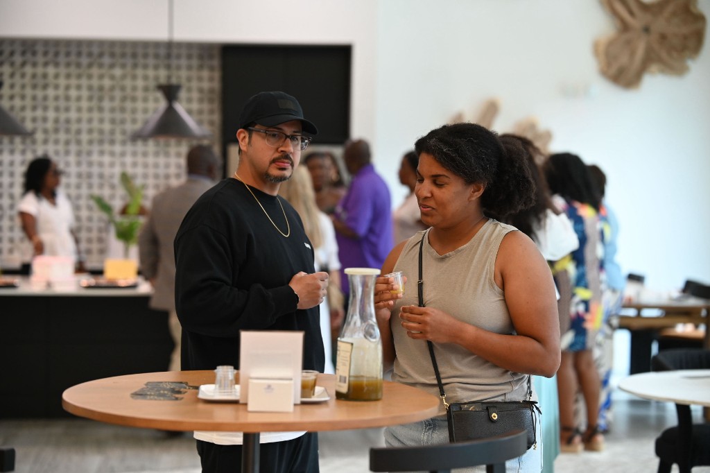Group tasting Prime Rise at a botanical beverage bar
