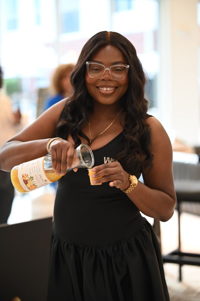 Prime Rise founder pouring Ginger Citrus for customers