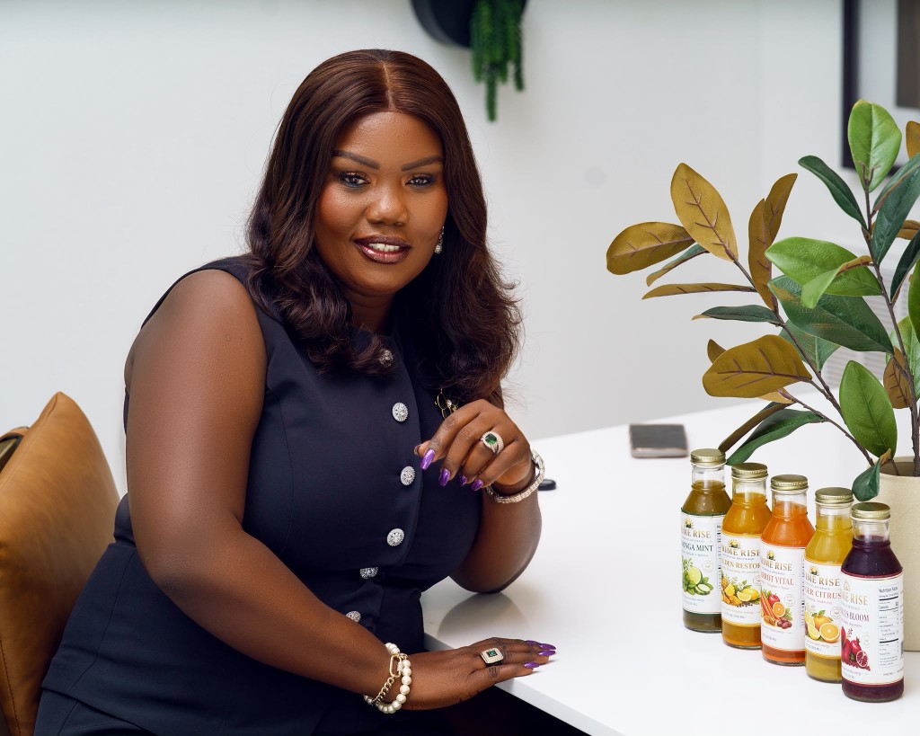 Prime Rise founder with the full botanical beverage collection on her desk